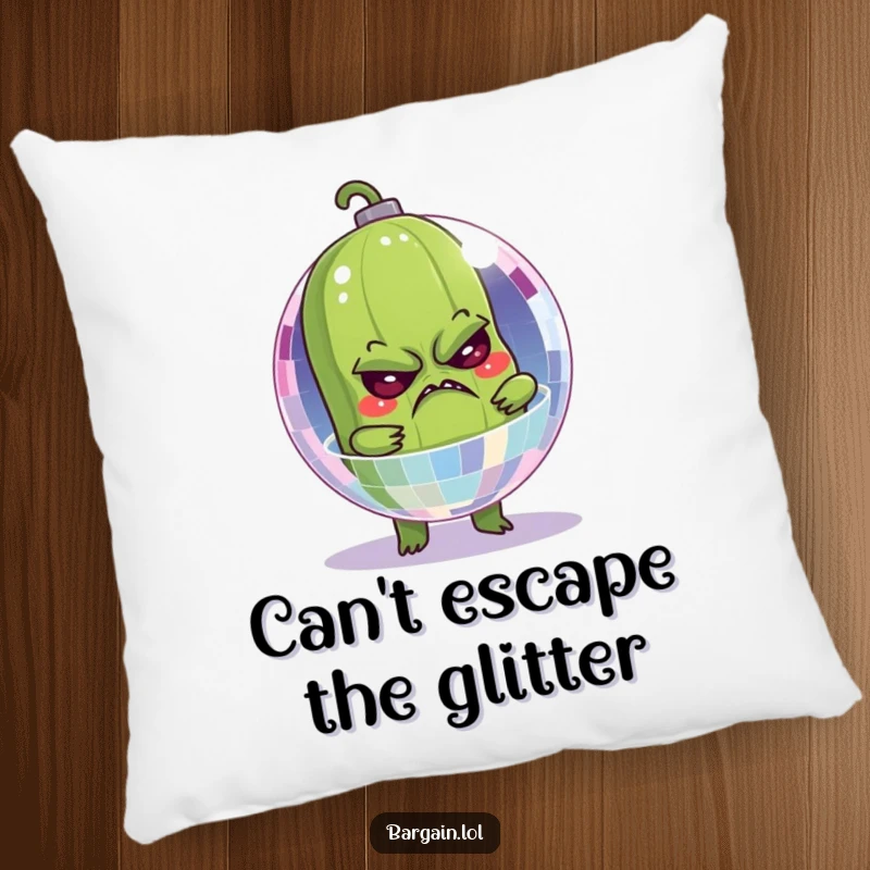 Funny pillow showing a grumpy pickle comically stuck inside a sparkling disco ball, perfect for humorous naps.