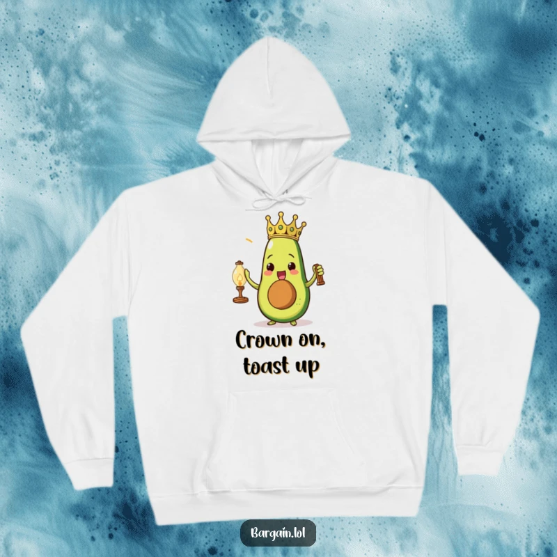 Funny triumphant avocado wearing a paper crown holding a dusty vintage lamp on a cozy hoodie.