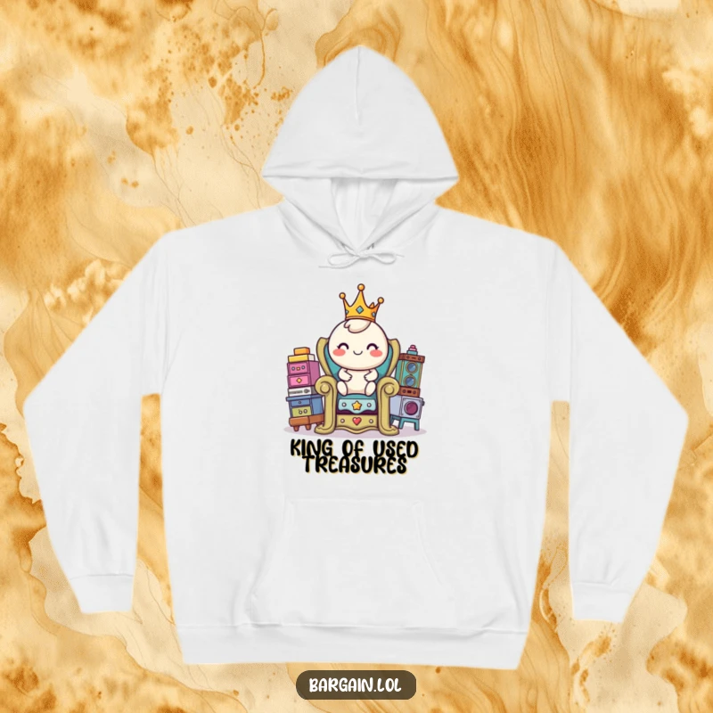 Funny hoodie featuring a cheerful, round character wearing a miniature crown, perched atop a throne constructed from various thrift store treasures.