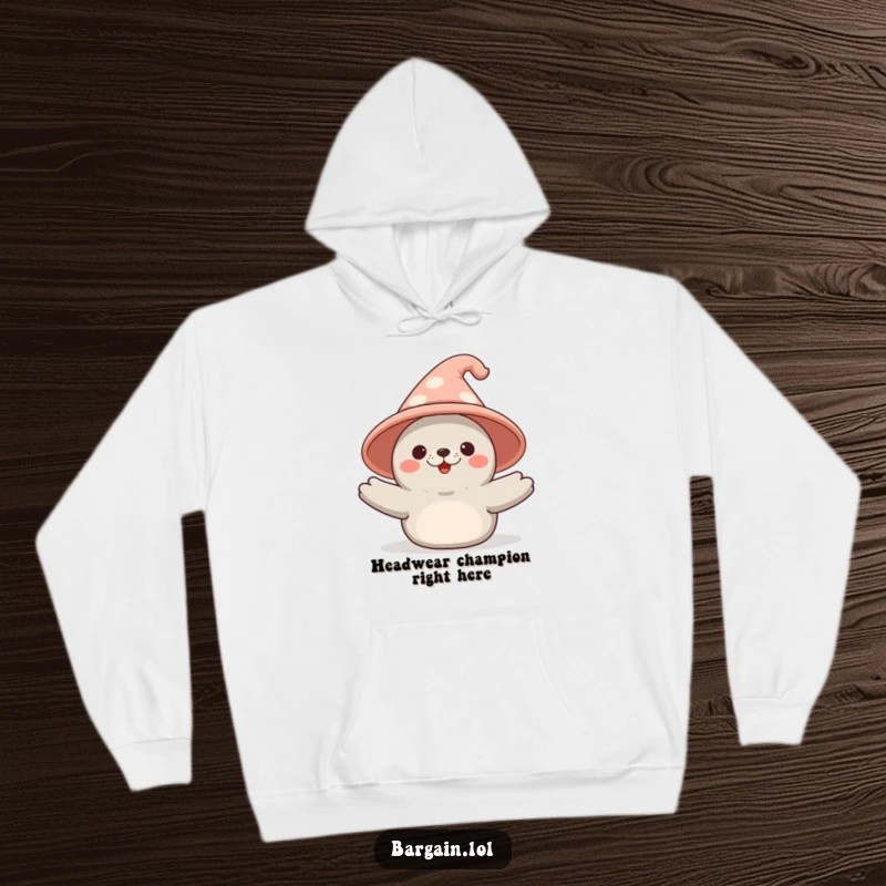 Funny Kawaii seal hoodie depicting a happy seal triumphantly presenting an oversized, comical novelty hat, great for cozy fun.